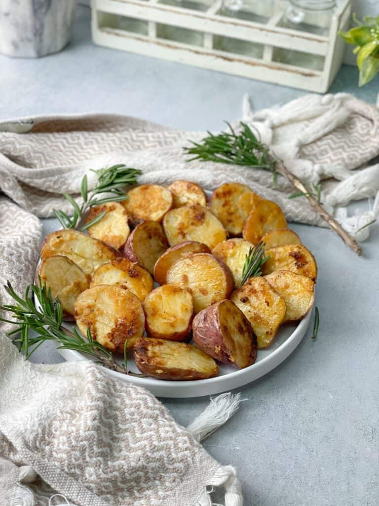 Baby potatoes cooked in the oven with parmesan and seasoned with olive oil, garlic, and rosemary