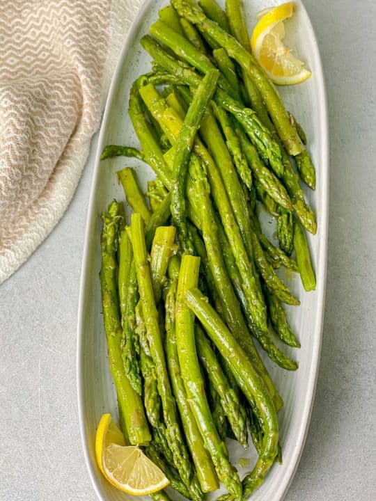 Healthy asparagus rich in flavor served with lemon. 