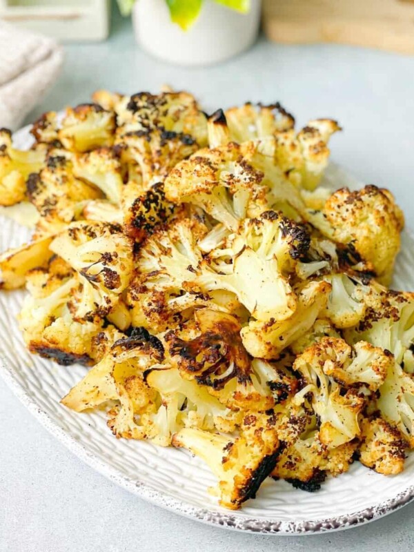 a plate of roasted cauliflower seasoned with olive oil garlic and paprika