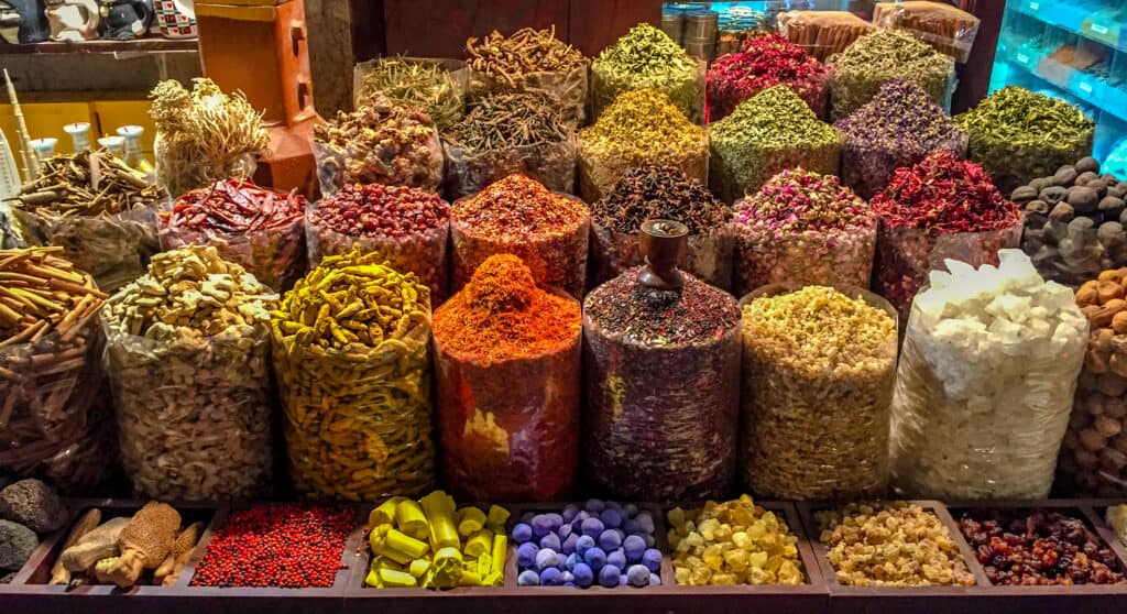 Bags filled with colorful and flavorful spices in a market