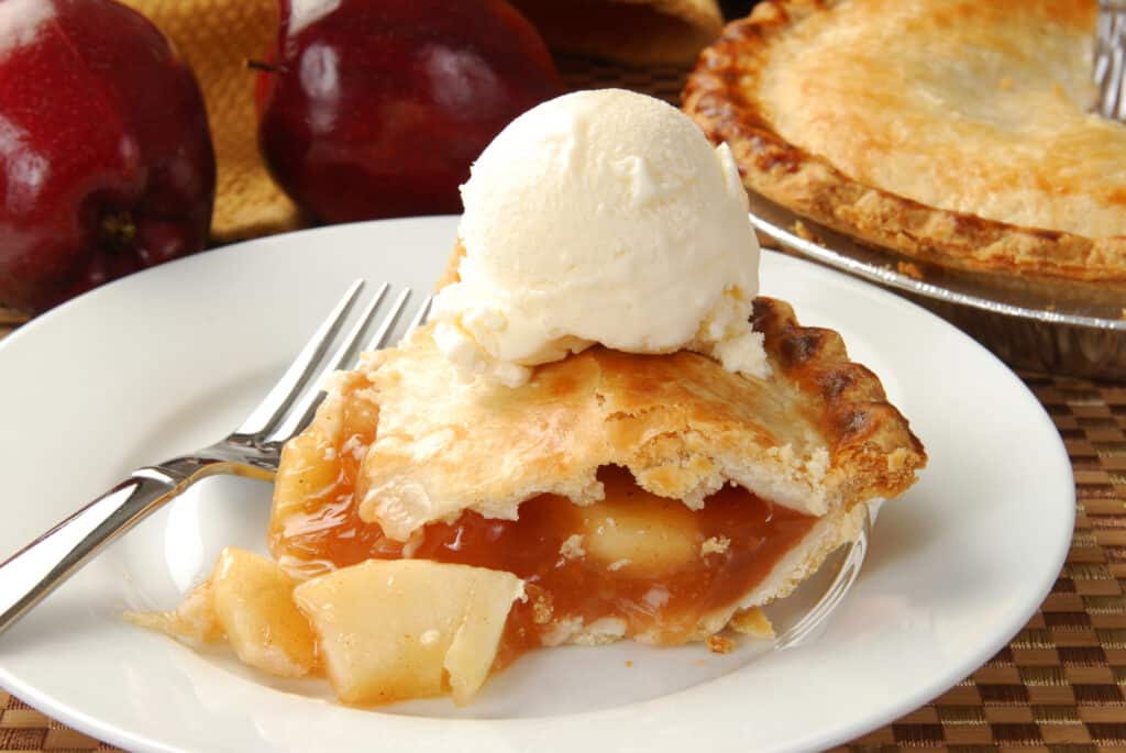 warm apple pie best served with a scoop of ice cream on top