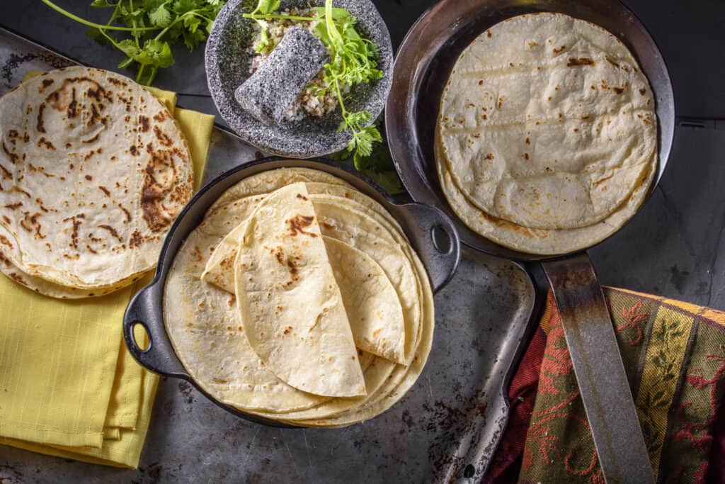 freshly baked gluten-free tortillas piled on each other