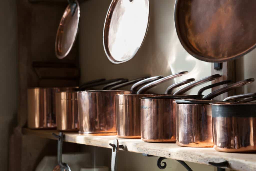 An image of old stainless steel pots and pans that could be cleaned to look new again