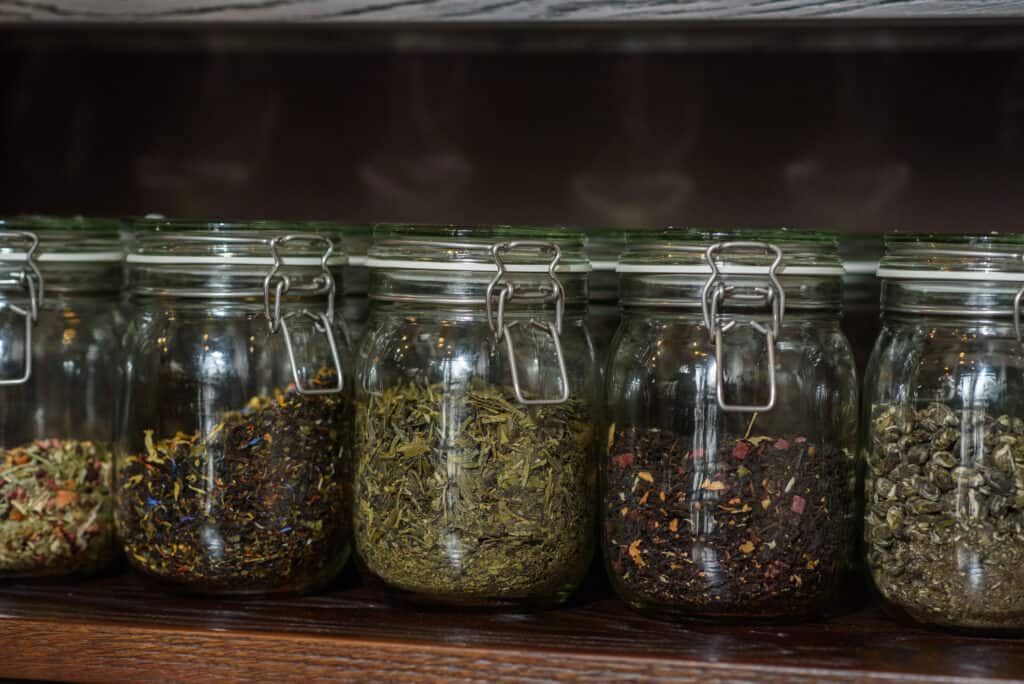 Glass jars to preserve herbs in a safe and warm place to keep the healthy and scrumptious flavor.