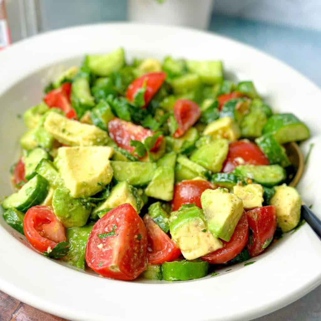 Avocados, cucumbers, tomatoes and cilantro are all tossed together with olive oil and lemon juice.