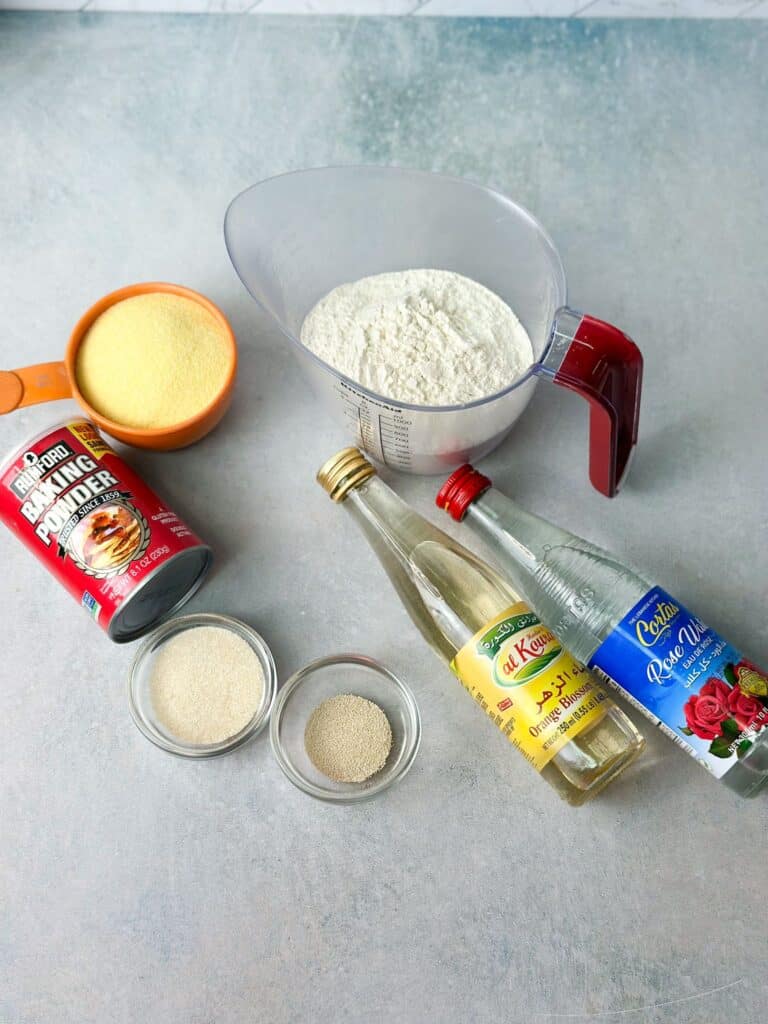 atayif ingredients: flour , semolina, yeast, baking powder, blossom water, and rose water