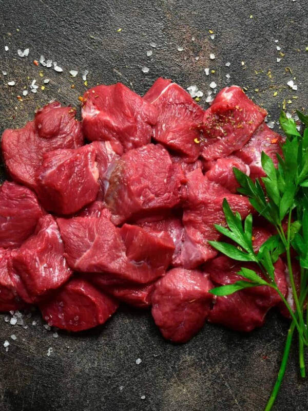 raw organic meat on a dark metal background