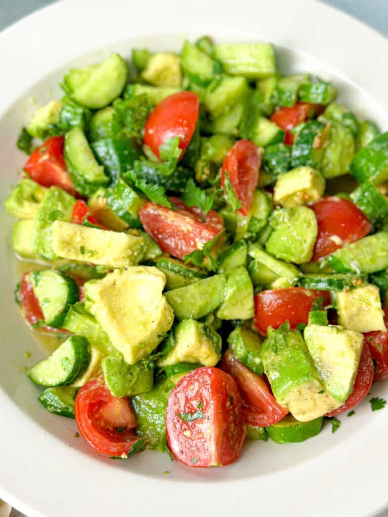 A colorful dish of veggies and tangy lemon dressing.