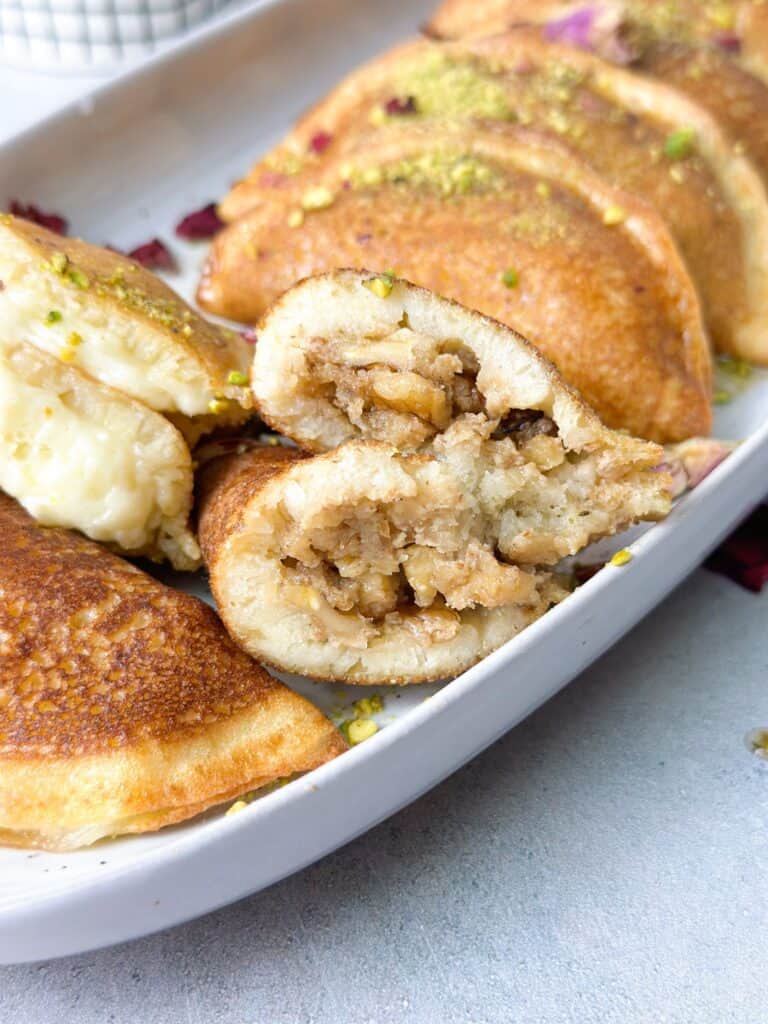 crunchy atayif filled with cheese and walnuts and drizzled with simple syrup.
