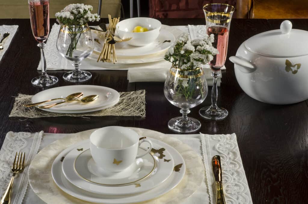  White porcelain tea set on a dinner table.