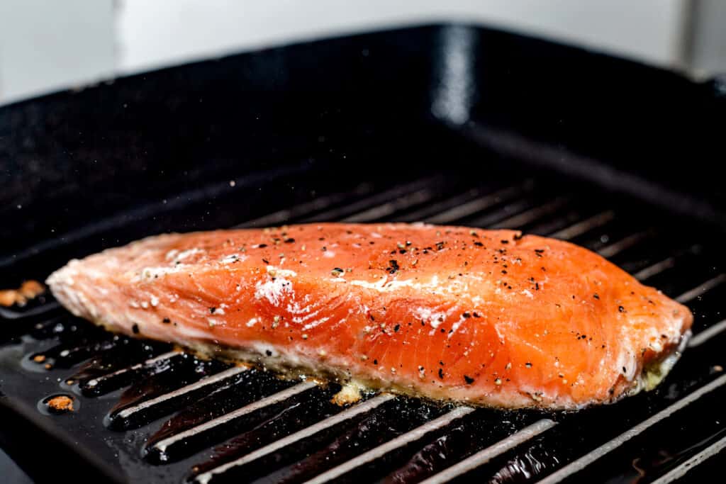 Grilled Salmon garnished with spices.