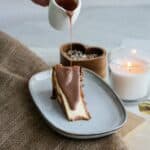 High protein chocolate sauce drizzled on top of a piece of cake for an extra flavor