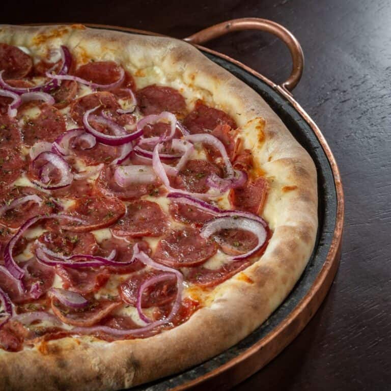 A crispy pepperoni and onion pizza dough