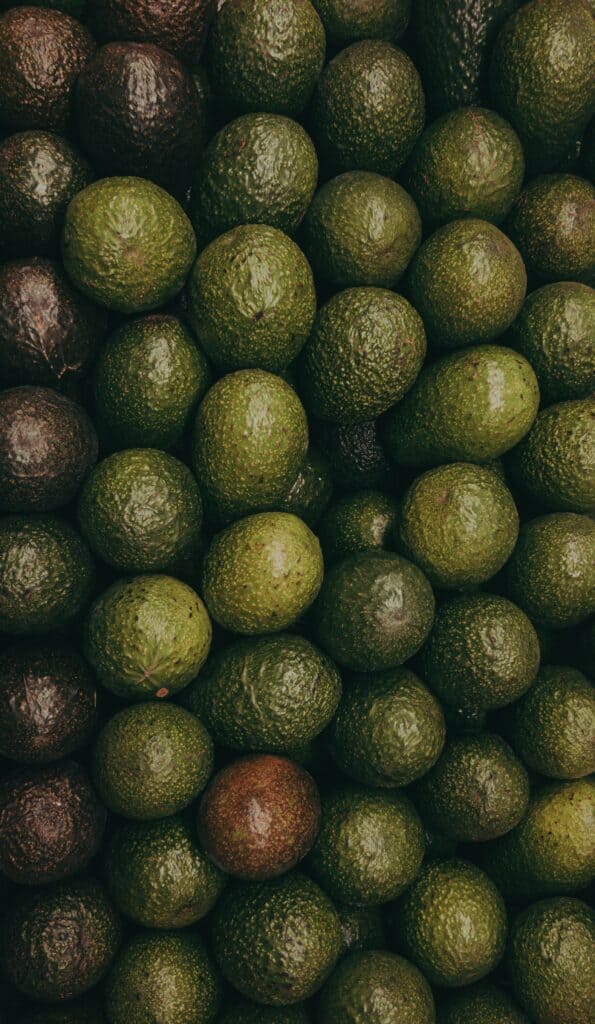 Avocados with various skin in different stages of ripeness