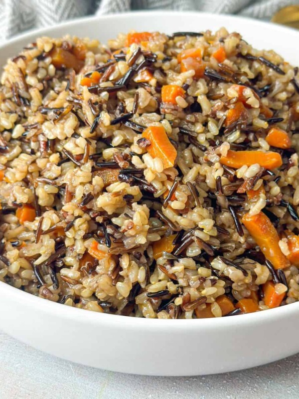 wild rice with onions and carrots in a bowl