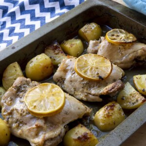 Oven baked Greek lemon chicken and potatoes with fresh herbs