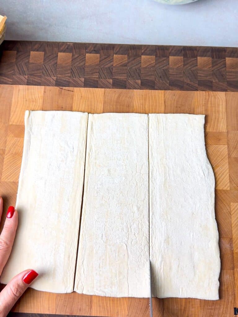 puff pastry dough cut into 3 vertical lines