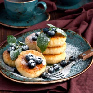 Colorful Pancakes featuring Cottage Cheese, Fresh Blueberries, and a sprinkle of Powdered Sugar on top