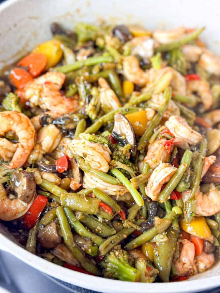 Shrimp stir fry with a medley of vegetables, glistening with savory sauce