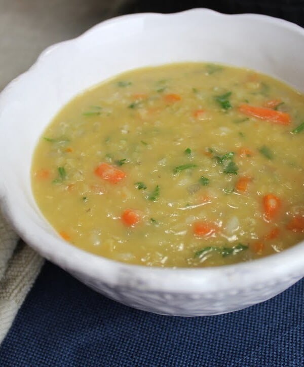 Red lentil soup with chopped carrots, onions, and parsley