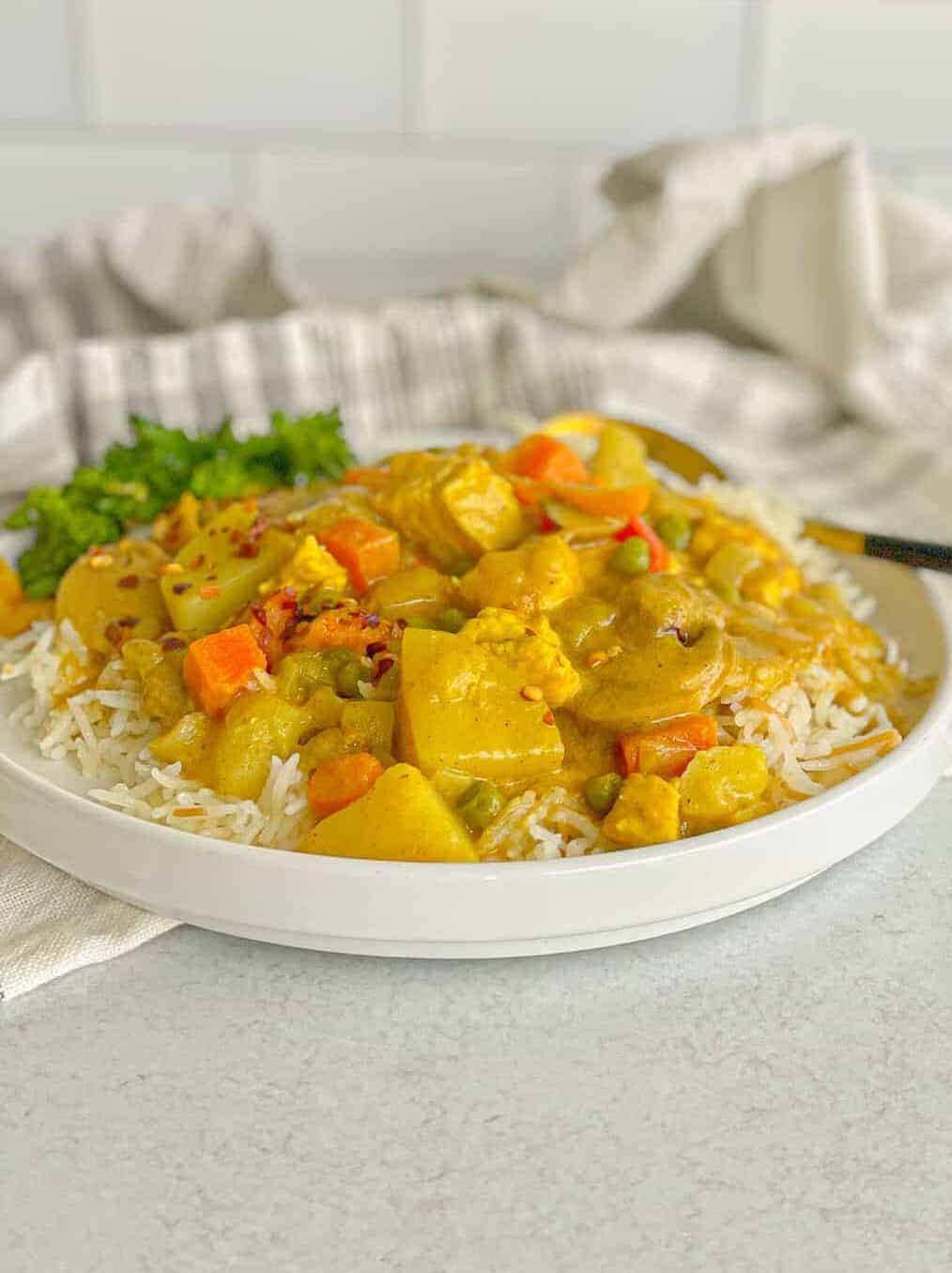 Creamy and easy chicken vegetable curry on a bed of white rice