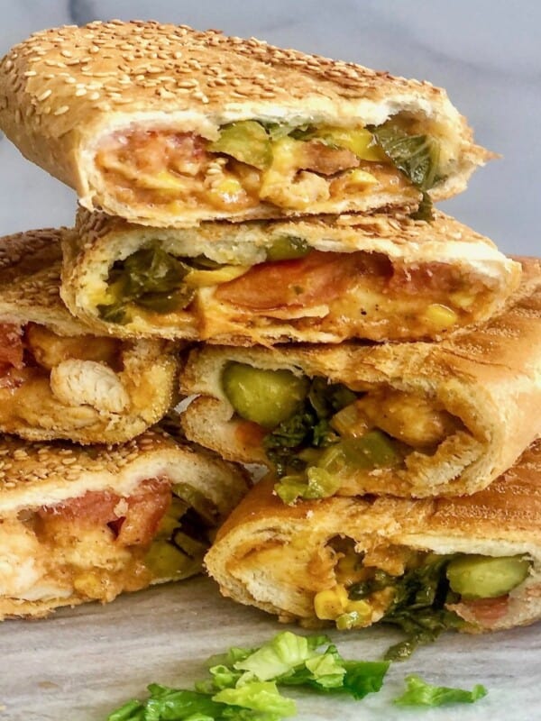 Grilled chicken with pickles, corn, lettuce and mayonnaise in sandwiches