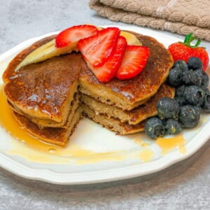 pancakes made with bananas, almond, old fashioned oats, baking powder, and pure vanilla topped with banana and strawberry