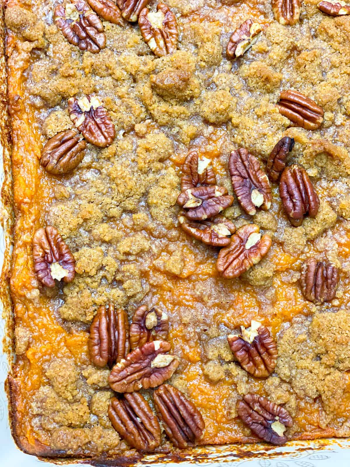 A sweet potato casserole topped with crunchy pecans.