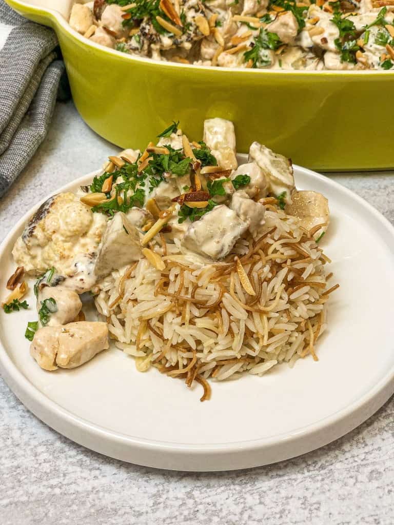 A delicious Cauliflower Tahini Bake served with a rice base.