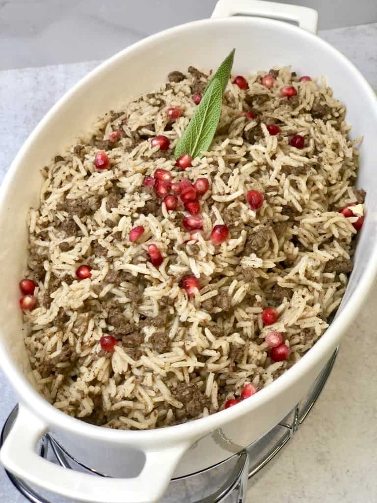 "Aromatic ground meat seasoned with warm spices, mixed with fluffy rice, creating a comforting and flavorful Lebanese rice hashwe.