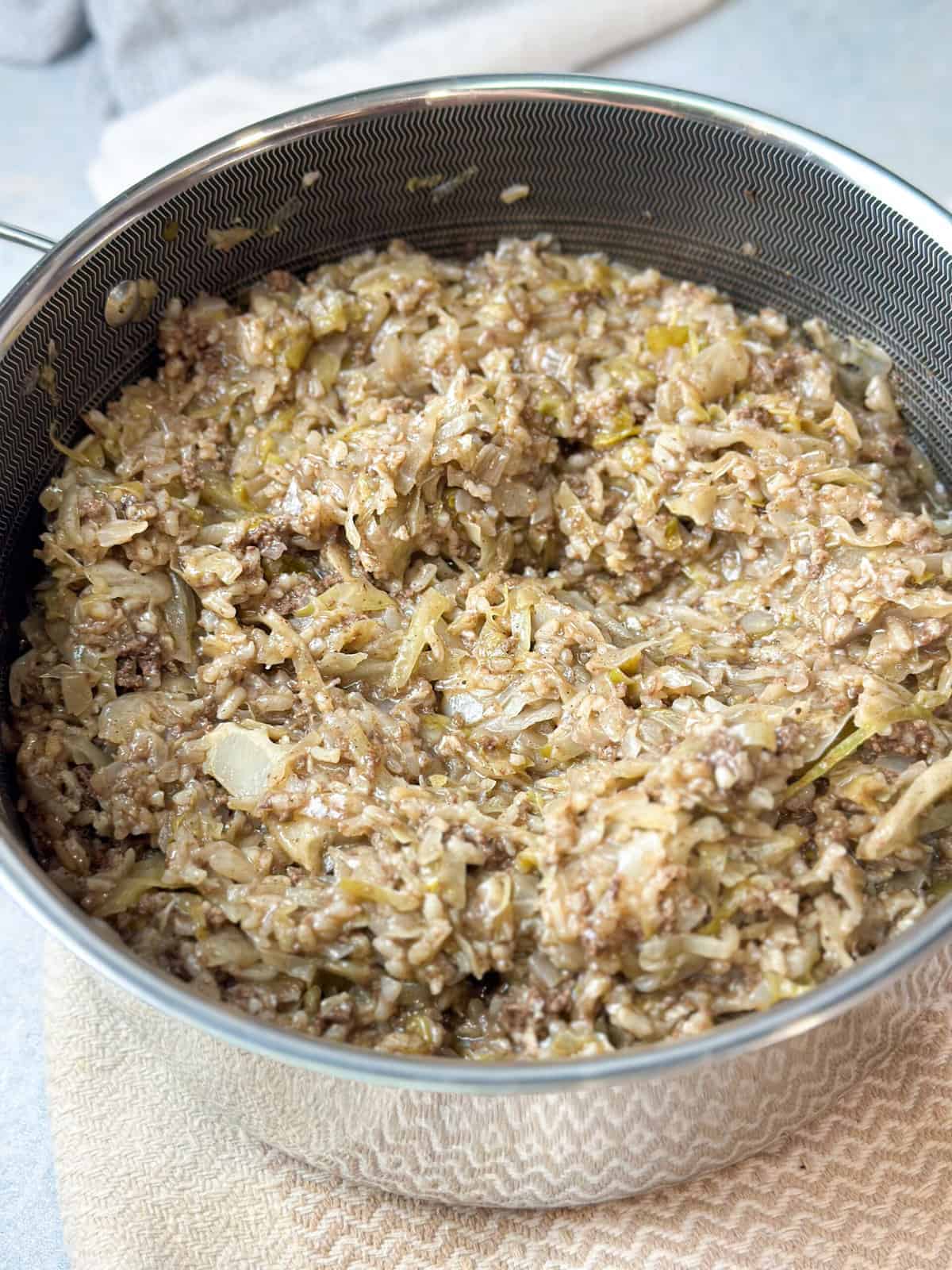 a pot of unstuffed cabbage with rice and ground beef