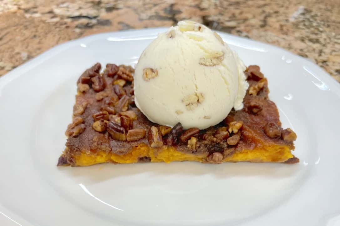 A slice of Sweet Potato Casserole with a scoop of delicious icecream.
