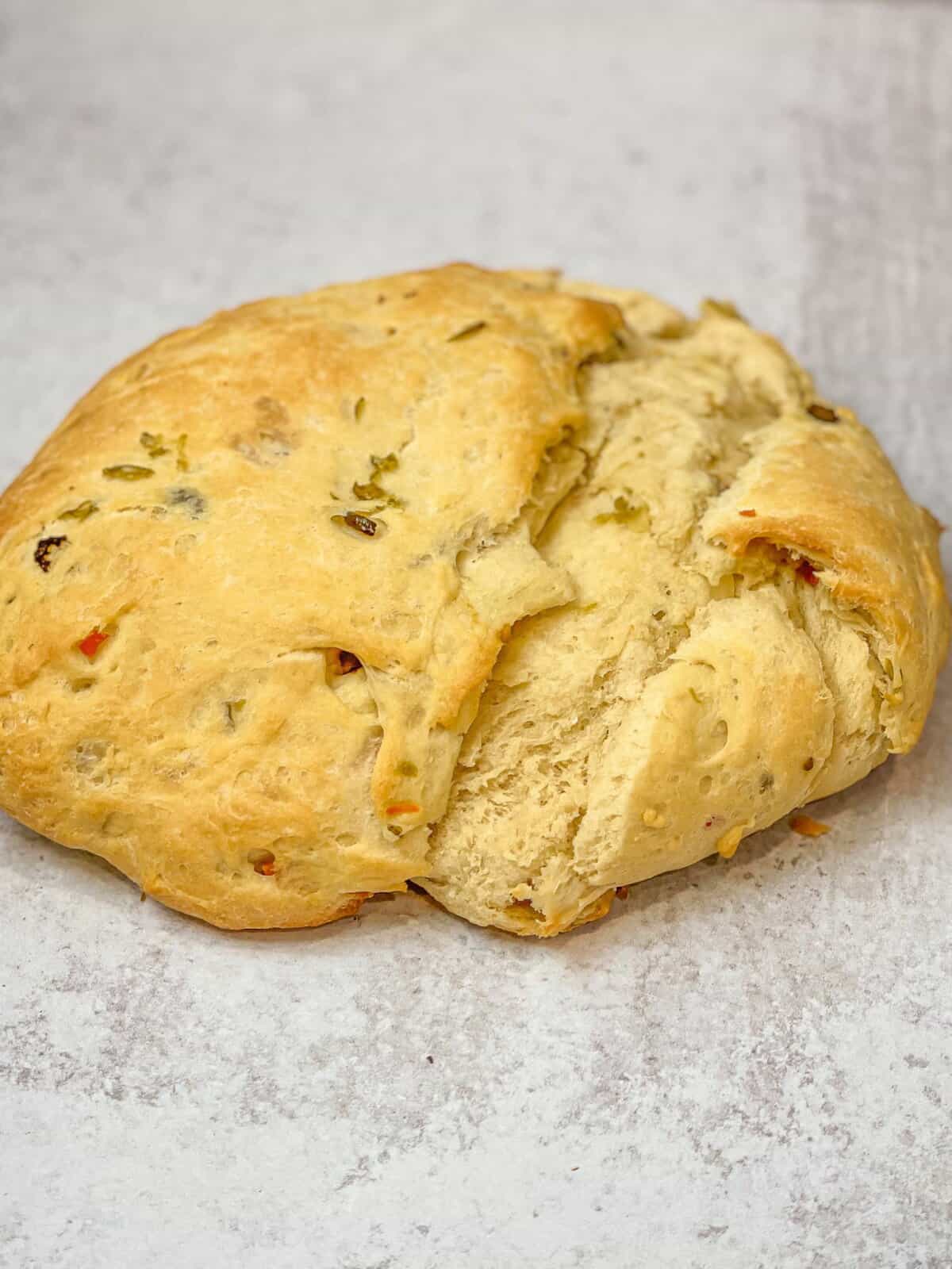 A simple yet flavorful homemade olive bread with a deliciously tangy taste, perfect for any occasion.
