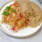 Fesenjan, a tasty traditional Persian Walnut Stew served on a plate.