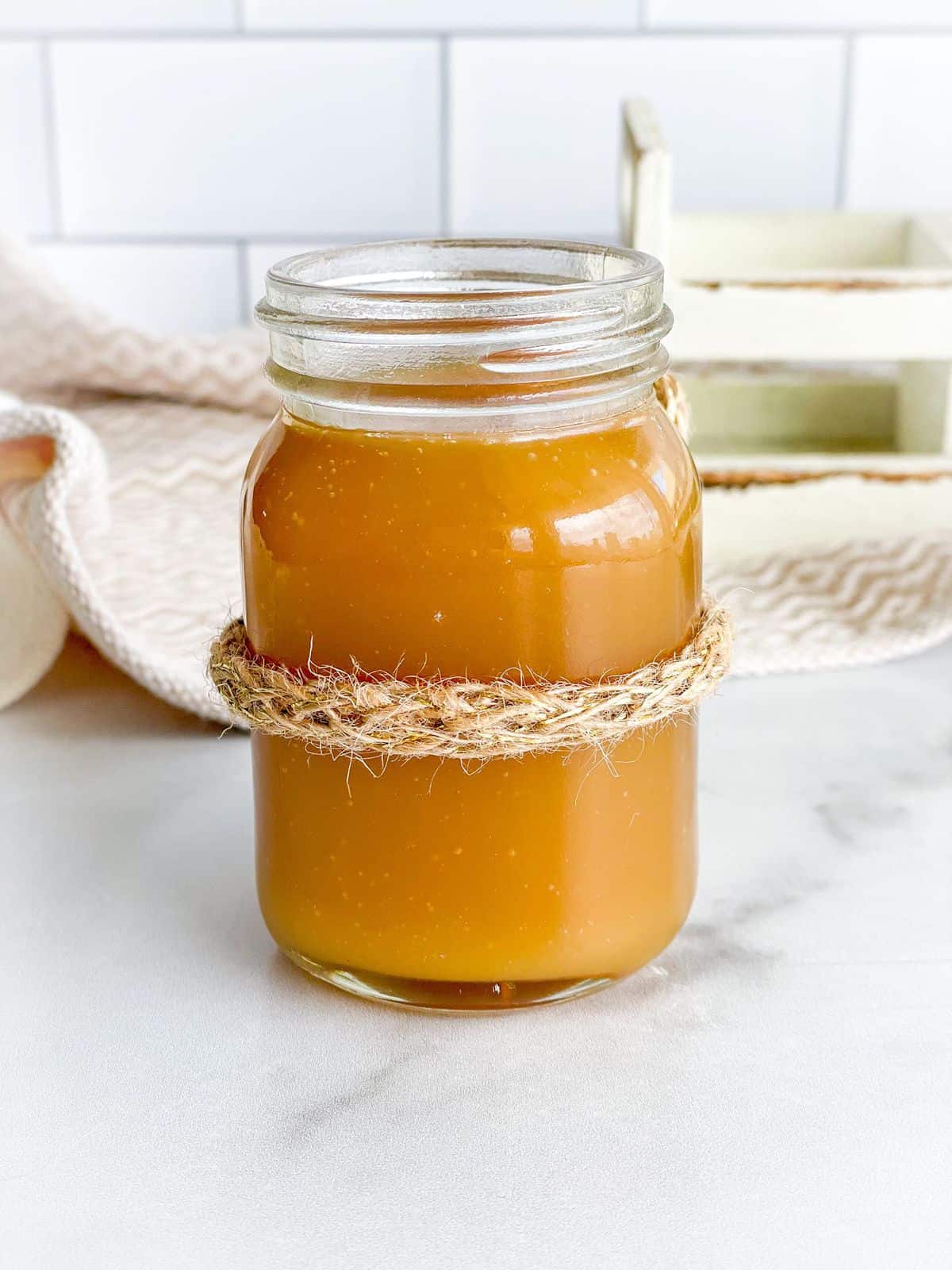A jar of an easy three ingredient caramel sauce