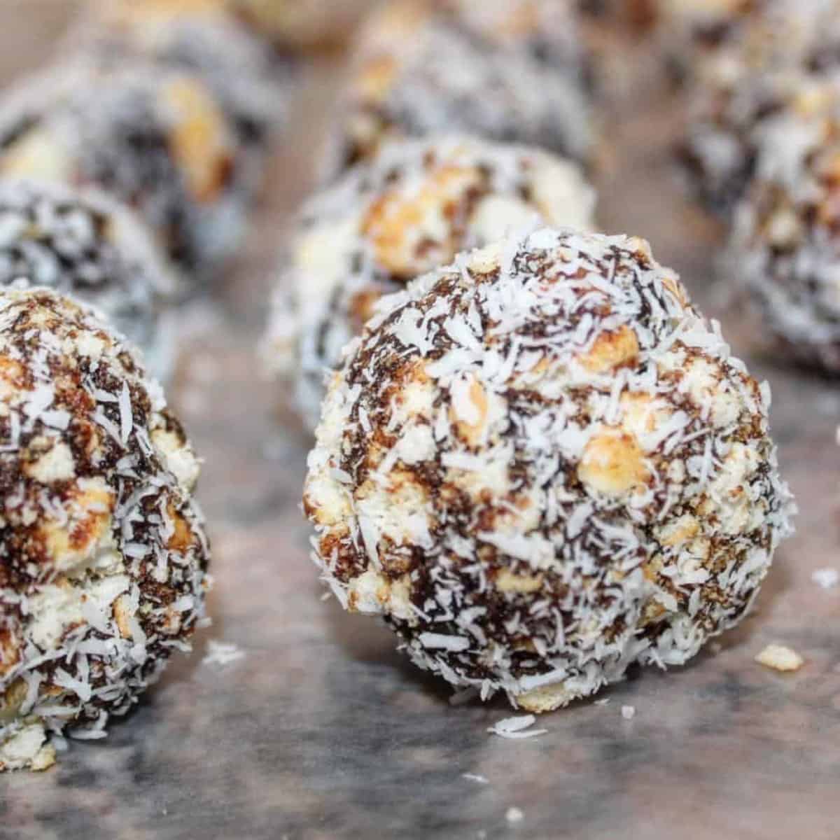 delicious balls made with date paste, walnuts, and covered with coconut flakes