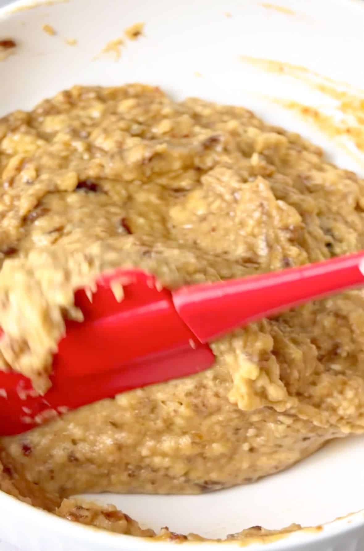 sticky date pudding mixed with a spatula