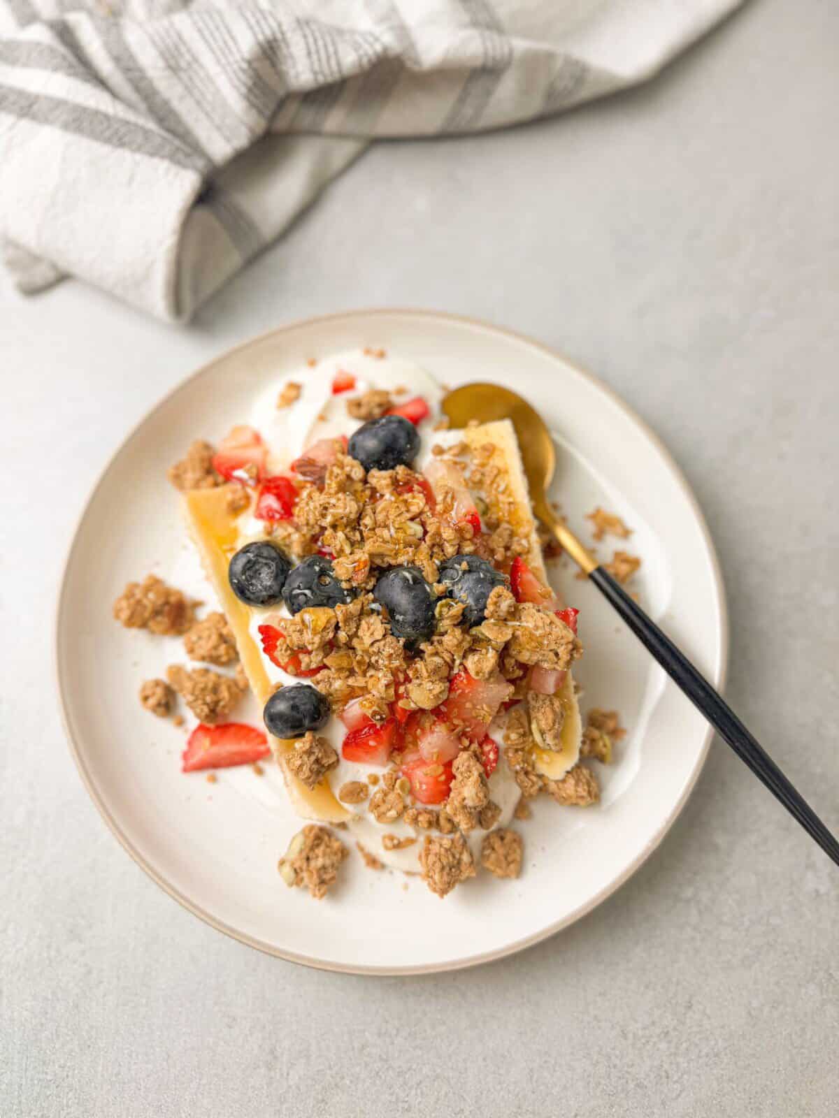 Breakfast Banana Split A kid-friendly Greek Yogurt Banana Split with colorful toppings, perfect for a healthy treat.