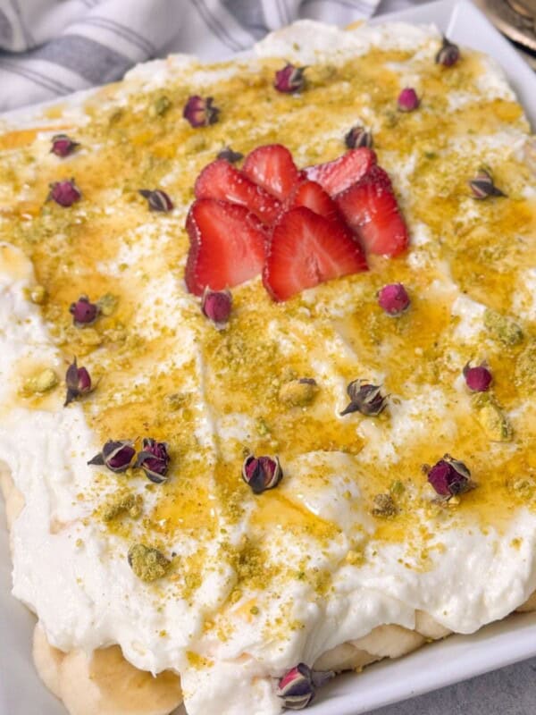 no-bake fresh fruit cake with ashta cream served in a pan