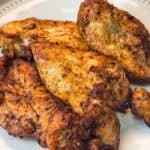 tender juicy air fryer chicken breast served on a large platter
