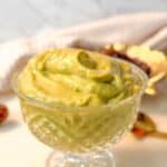 Close-up of a glass bowl filled with creamy avocado date pudding