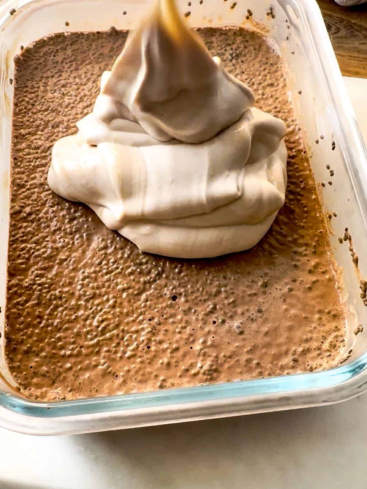 Steps To Prepare Mocha Chia Pudding Cake adding Yogurt frosting over the chia pudding layer