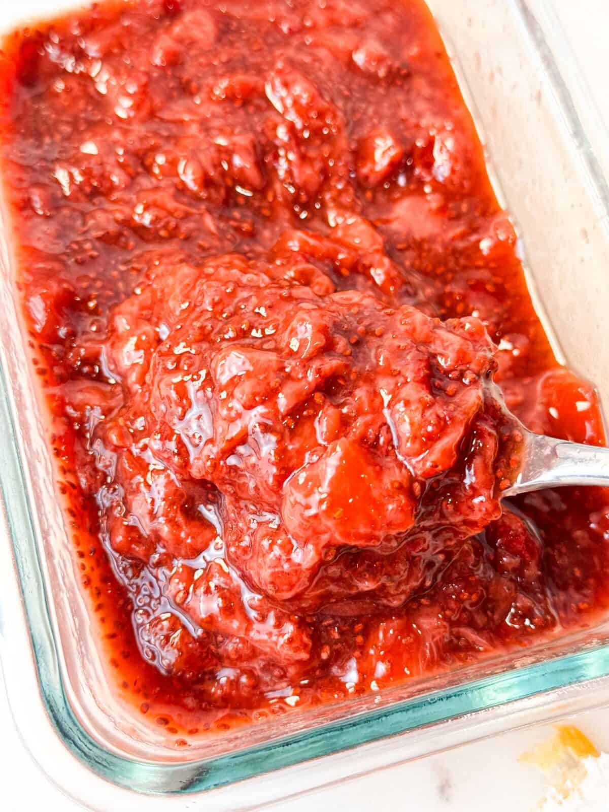 Strawberry Chia Jam A Pyrex container filled with homemade strawberry chia seed jam