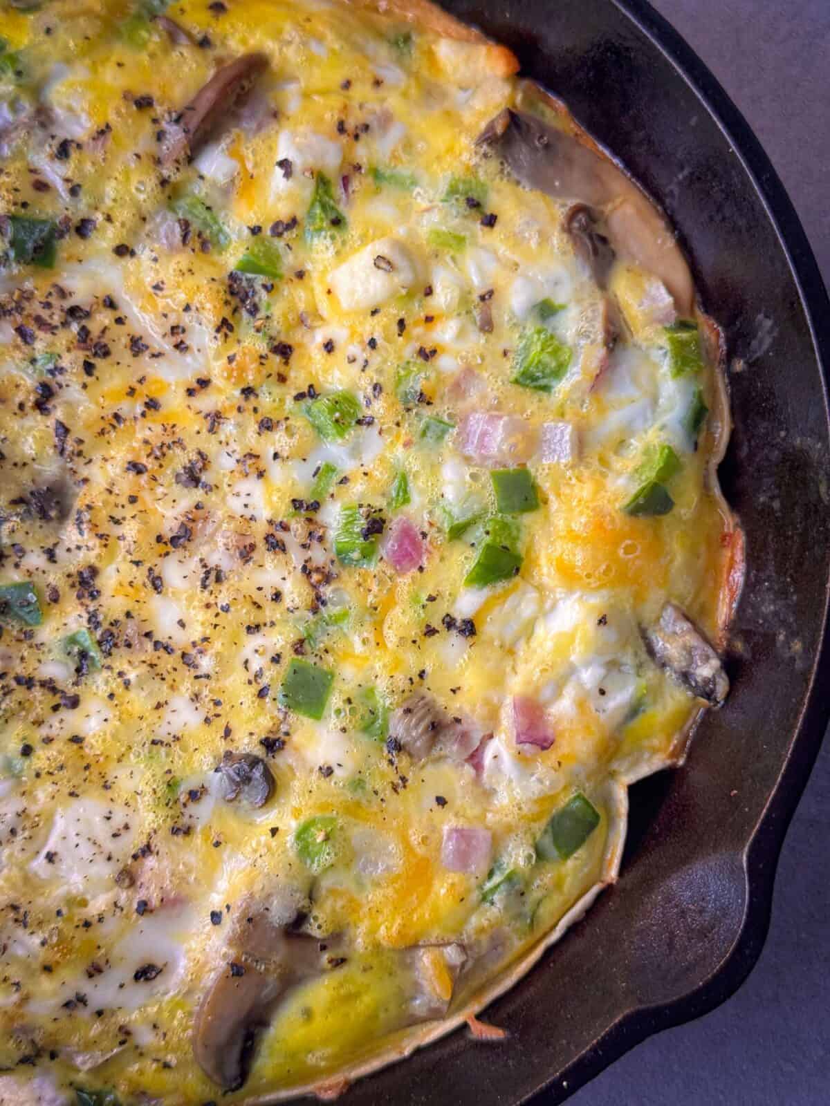 Healthy Breakfast Bake High Protein Breakfast tortilla quiche with creamy cottage cheese filling, golden edges, and colorful vegetables.