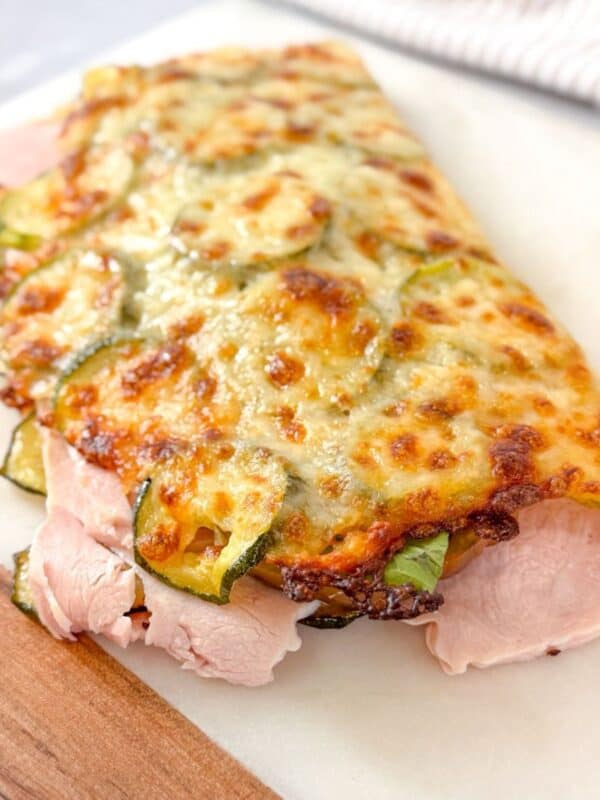 Gluten-free cheesy zucchini bread wrap filled with turkey and greens.