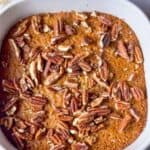 a top shot of sweet gingerbread rice casserole topped with chopped pecans