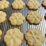 golden-brown vanilla petit four cookies arranged neatly after baking.