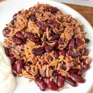 Traditional Lubya Hamra with red kidney beans, rice, and caramelized onions served with yogurt
