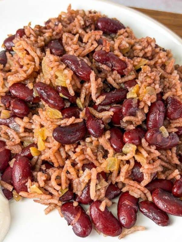 Traditional Lubya Hamra with red kidney beans, rice, and caramelized onions served with yogurt